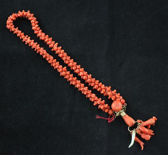 A carved coral bead pendant choker necklace, 12in.